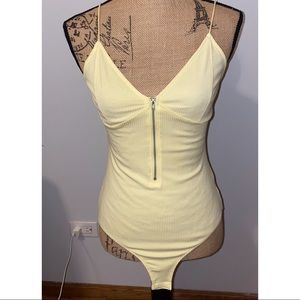 Pale yellow bodysuit